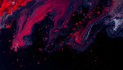 A dynamic mix of swirling red and blue liquid on a black background, with splashes and bubbles. Ideal for themes of art, science, and dramatic motion.