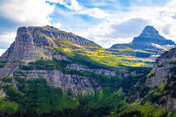 Scenic Green Lush Valley with Mountains in the Back at Glacier National Park
