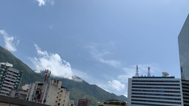 Spectacular Caracas City TIME LAPSE video, showing the iconic El Avila or Waraira Repano mountain, and office buildings with telecommunications antennas.