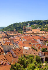 Panoramic View Over Historic Rooftops in Prague on a Clear Summer Day