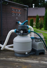 The pump that drives the filtering and ozonation process to keep an outdoor pool hygienic.