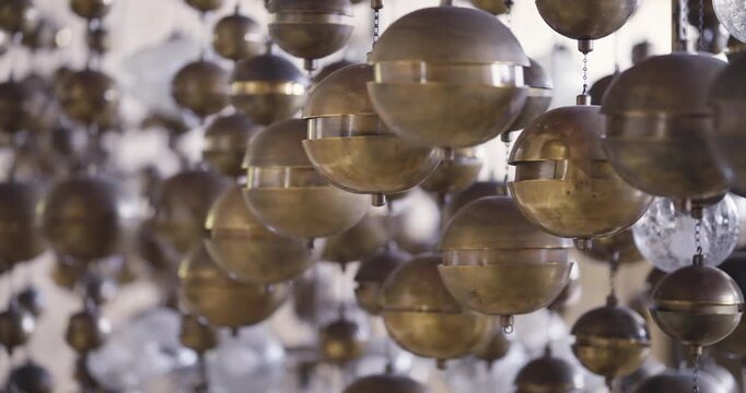 Artistic arrangement of metallic ball spheres intertwined with glasslike light elements creating an enchanting visual appeal background and space depth