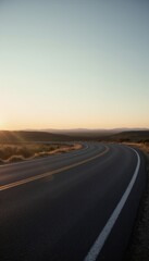 A long empty road with two yellow lines going down it.