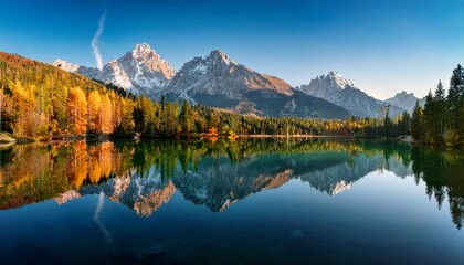 mountain lake reflecting peaks