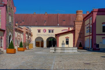 View of the courtyard of the Regent brewery and its building in Třeboň, a sunny summer day