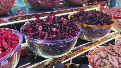 Array of colorful spices and herbs in a traditional old market in Dubai