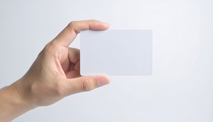 Hand holding blank white card