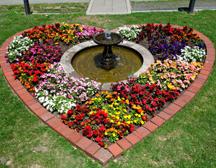 Heart shaped flower bed with fountain