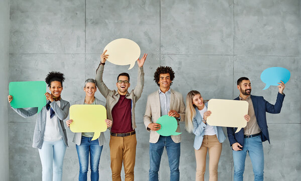 Portrait of a group of young business people in office. Speech bubble, team and comment by business people holding sign, news and voice icon feeling excited on social media. Group, opinion and poll by