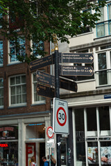 Amsterdam street signpost with directions to landmarks and central station