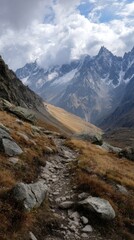 Mountain trail winds through autumnal landscape