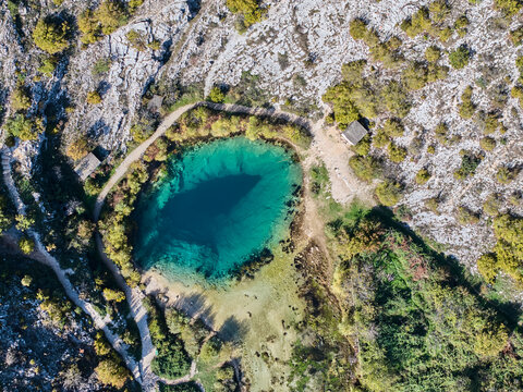 The Eye of Earth, source of the Cetina River in Croatia, a stunning karst spring near Dinara mountains with unique turquoise depths.