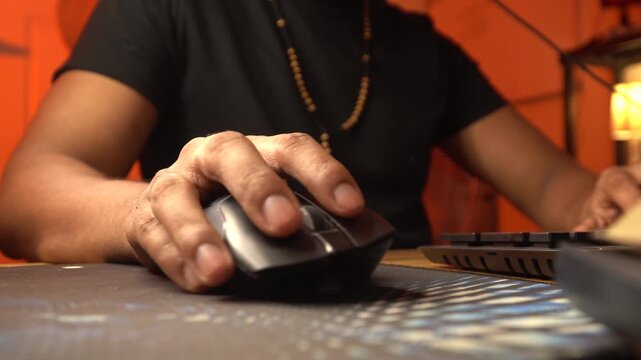 Gamer repeatedly clicking mouse and shaking hands