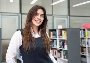 Librarian smiling in a library