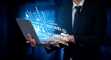 A business professional stands holding a laptop with various finance and tax terms dynamically displayed, representing modern corporate challenges and innovative solutions. Tessel