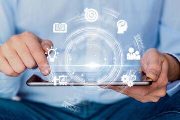 Skills Development. Businessman hold digital icons