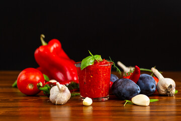Tomato garlic sauce with basil in clear glass jar