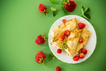 Delicious pancakes with strawberries and soft cottage cheese
