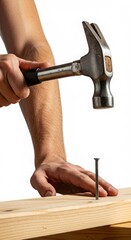 Man hammering nail into wooden plank