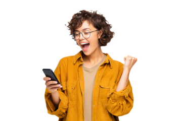 Excited Woman in Yellow Looks at Phone. Authentic shot ideal for social media, advertising.