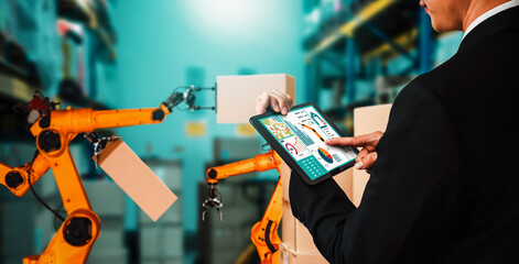 Smart robot arm systems for innovative warehouse and factory digital technology . Automation manufacturing robot controlled by industry engineering using IOT software connected to internet network .