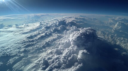 Aerial view of layered clouds from airplane perspective with cotton like texture and blue sky gradient conveying height freedom atmosphere and soft natural serenity