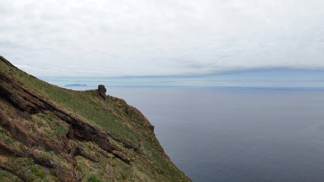 Beautiful view of the mountains and the Christ the Redeemer Statue while flying over the city of Canico - in the south of Madeira Island, Portugal.
