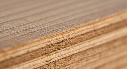 Fototapeta premium Macro close-up of stacked wooden planks showing natural grain and texture, a beautiful material for construction and design