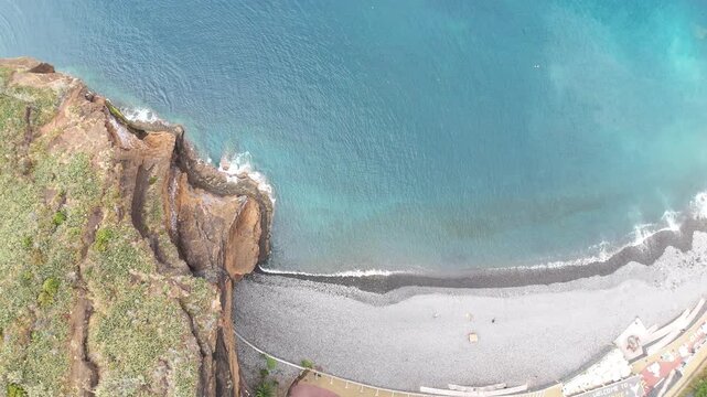 Beautiful view of the mountains and the Christ the Redeemer Statue while flying over the city of Canico - in the south of Madeira Island, Portugal.