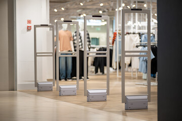 Radio-frequency security gates with integrated metal detector at a clothing store entrance