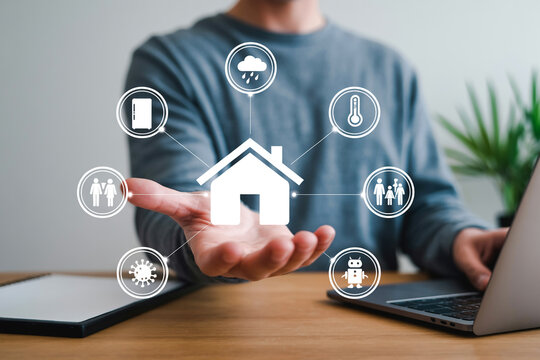 Smart Home Automation Concept with Person Holding House Icon and Connected Devices for Modern Living Technology