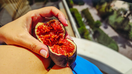 Two Fresh Figs in Hand by Pool