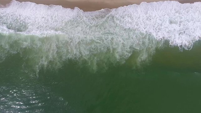 Top Down Aerial View of Waves Breaking onto Beach at Chatham, Cape Cod