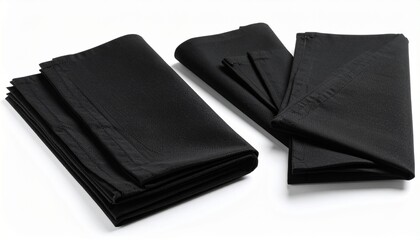 Neatly folded black fabric pieces arranged in uniform spacing on a white surface — symbolizing minimalism, precision, and refined textile presentation
