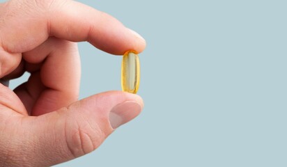 Medical pill in hand on background, Taking Medication