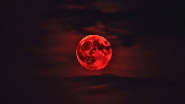 Dramatic blood moon glowing intensely in dark sky, perfect for horror or fantasy themes - Powered by Adobe