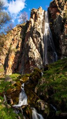 Waterfall cascading down a rocky cliff face