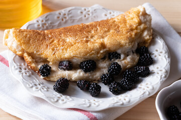 Omelette with blackberries