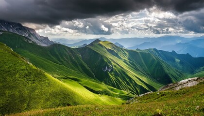 Fototapeta premium green mountains under dramatic sky