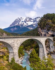 Alpine mountain bridge over a river