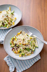 Close up of Simple Vegetarian Side with Green and Yellow Zucchini and Toasted Almonds