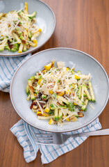 Close up of Simple Vegetarian Side with Green and Yellow Zucchini and Toasted Almonds