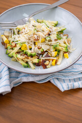 Close up of Simple Vegetarian Side with Green and Yellow Zucchini and Toasted Almonds