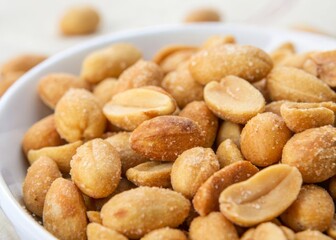 High-resolution macro image of salted peanuts with textured surface, ideal for healthy snack and food styling themes