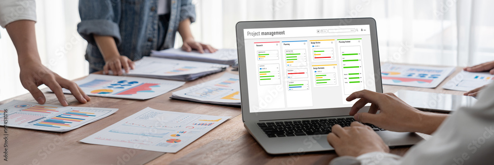Wall mural project planning software for brisk business project management on the computer screen showing timel