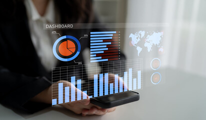A professional businesswoman engages with a digital dashboard, exploring key statistics and trends using her smartphone, emphasizing modern data analysis. Impute
