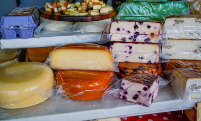Close-Up of Cheese Display with Blueberries and Variety of Cheeses