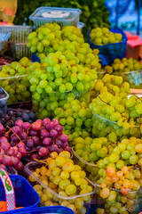 Assorted Grapes Displayed on Market Table, Wide View