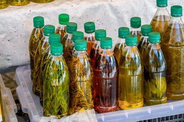 Bottles of Olive Oil with Rosemary at Local Market