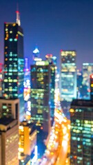 Obraz premium Vertical Night Cityscape Long Exposure Photograph With Bokeh Effect Featuring Illuminated Skyscrapers and Buildings in a Blue and Yellow Color Palette
